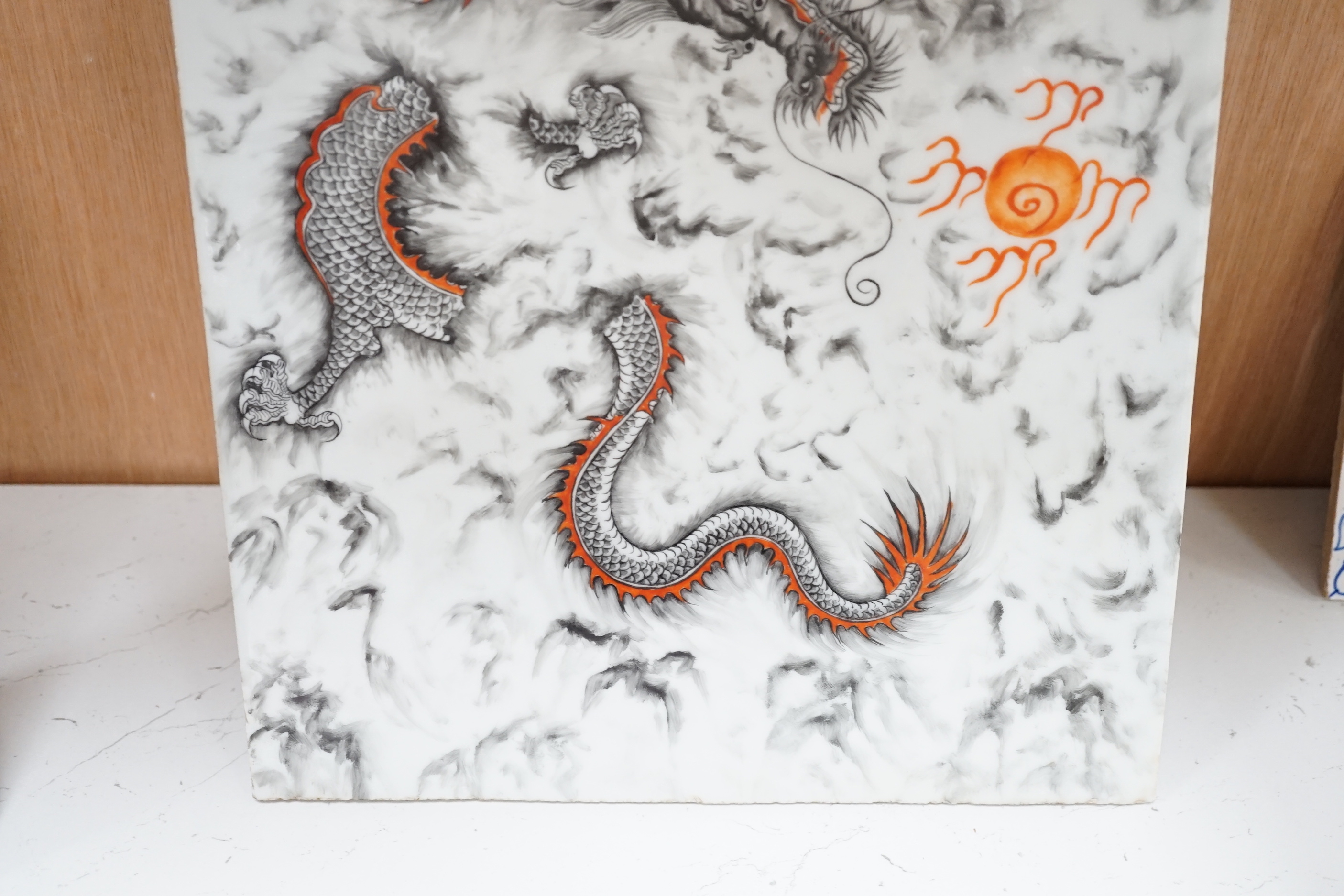 A Chinese porcelain rectangular dragon panel, 42cm x 26cm